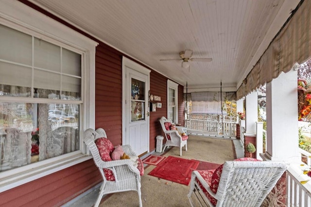 view of patio / terrace with ceiling fan and a porch