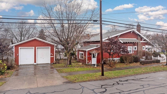 view of front of property with an outbuilding and a garage