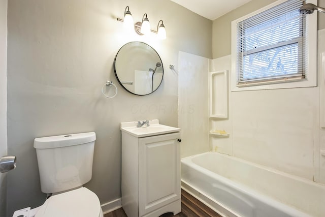 full bathroom featuring shower / tub combination, vanity, hardwood / wood-style flooring, and toilet