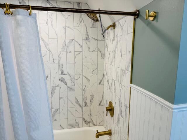 bathroom with shower / bath combination with curtain