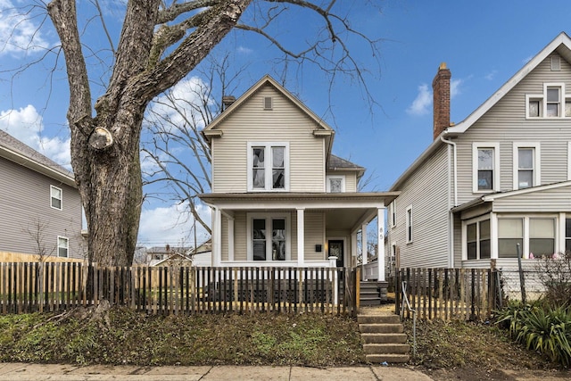 view of front property featuring covered porch