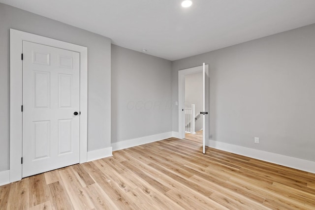 unfurnished bedroom featuring light wood-type flooring