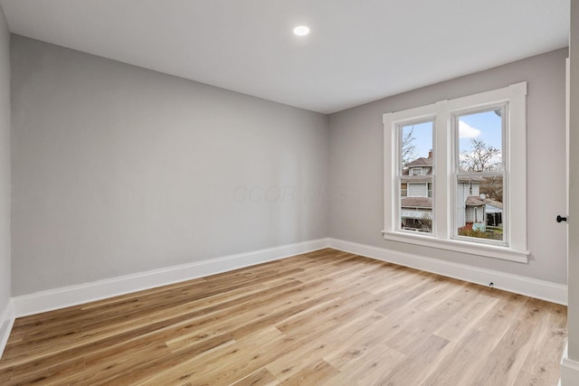 unfurnished room with light hardwood / wood-style flooring