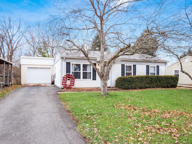 single story home with a garage and a front lawn