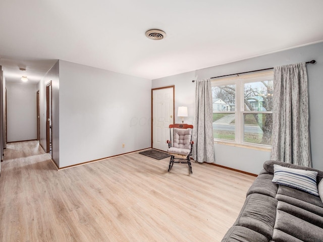 sitting room featuring light hardwood / wood-style floors