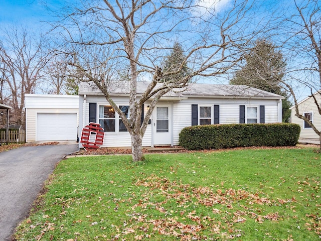 single story home featuring a garage and a front yard