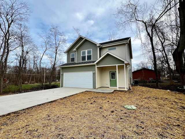 view of front of house featuring a garage and central AC unit