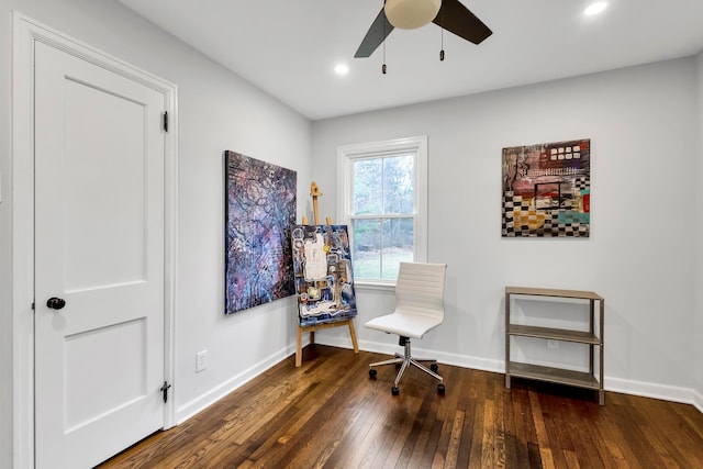 sitting room with ceiling fan and dark hardwood / wood-style flooring