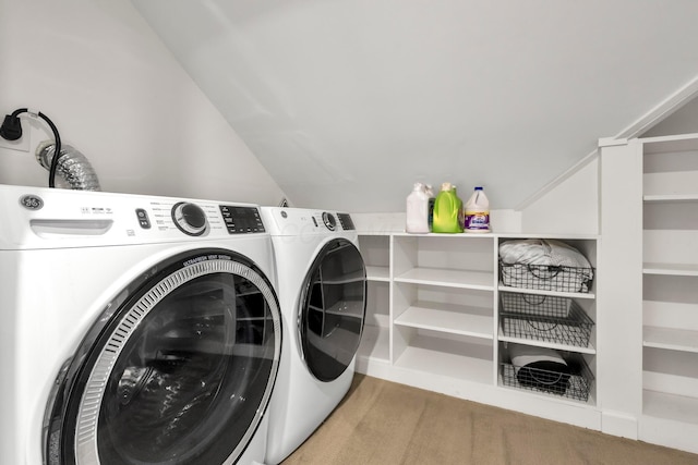 washroom featuring separate washer and dryer and light colored carpet