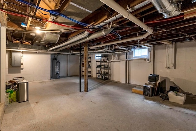 basement with electric panel and gas water heater