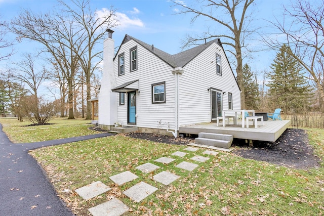 exterior space featuring a deck and a yard