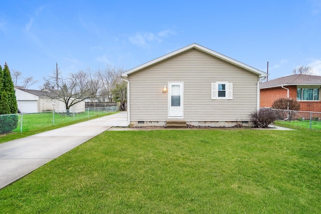 rear view of property featuring a yard