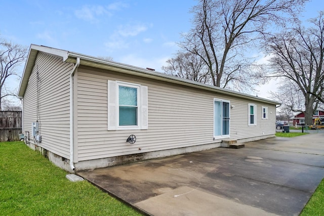 view of side of home featuring a patio