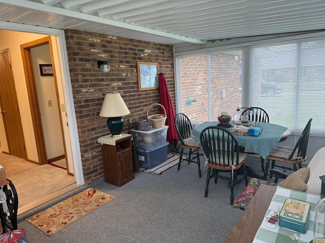 sunroom / solarium featuring beamed ceiling