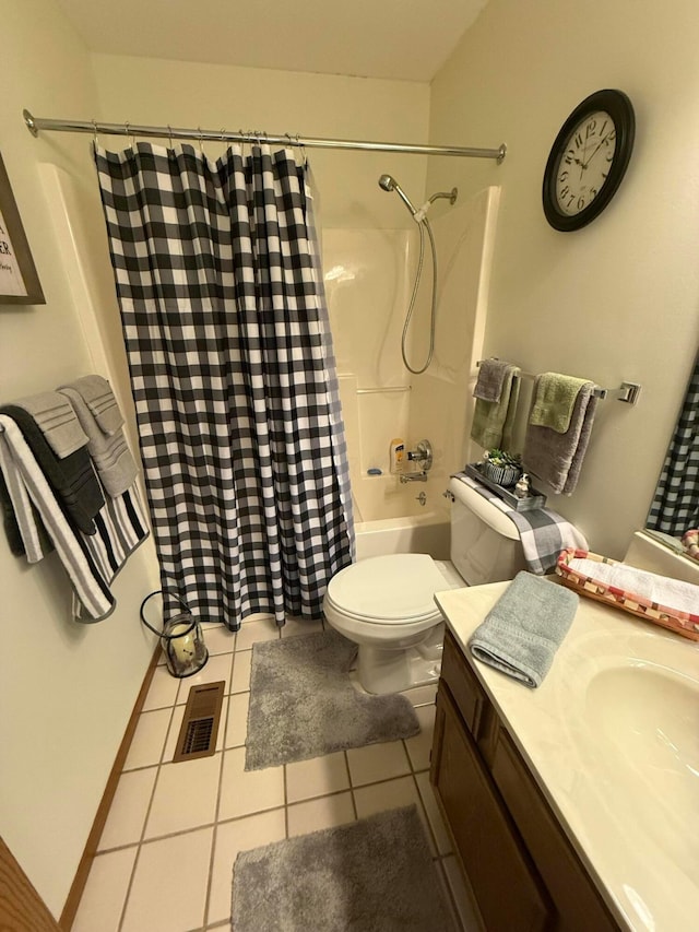 full bathroom with tile patterned floors, shower / bath combination with curtain, toilet, and vanity