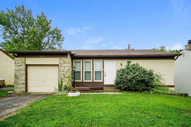 single story home with a garage and a front yard