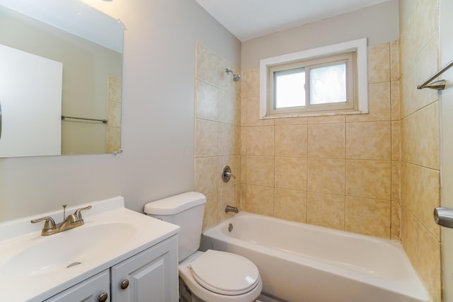 full bathroom with vanity, toilet, and tiled shower / bath