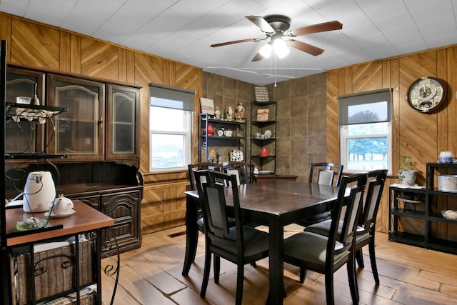 4417 Beechgrove Rd, Bucyrus, OH 44820 - dining room with hardwood / wood-style flooring, ceiling fan, and wood walls