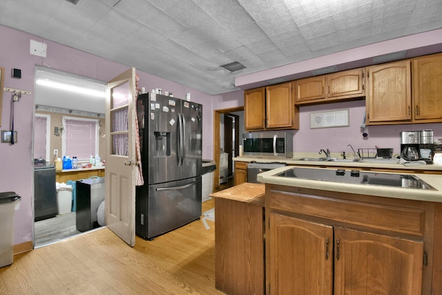 4417 Beechgrove Rd, Bucyrus, OH 44820 - kitchen with stainless steel appliances, light hardwood / wood-style flooring, and sink