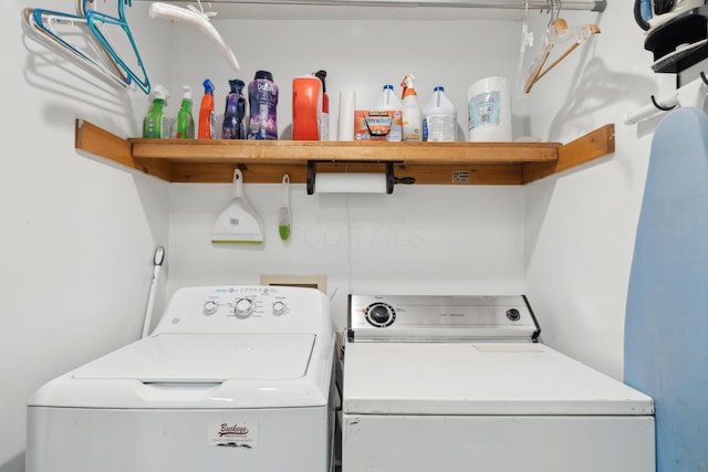 washroom with independent washer and dryer