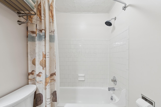 bathroom with shower / tub combo with curtain, a textured ceiling, and toilet