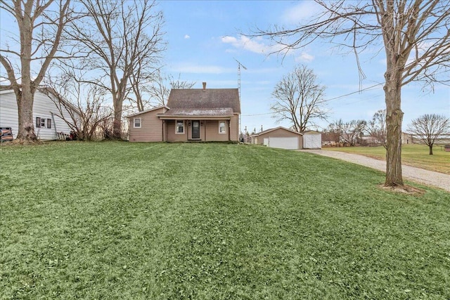 view of yard with an outbuilding and a garage