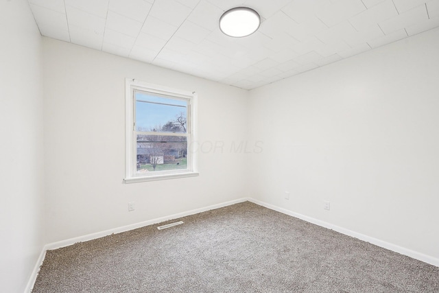 spare room featuring carpet flooring