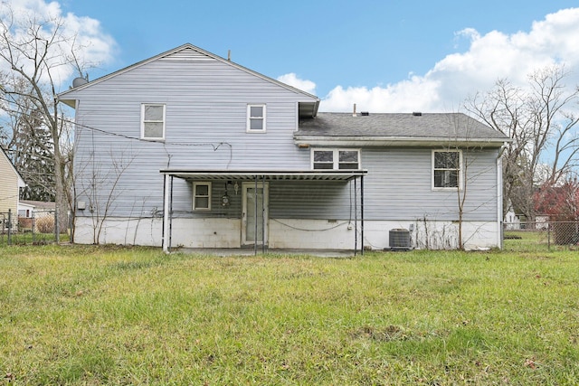 back of property featuring a yard, cooling unit, and a patio