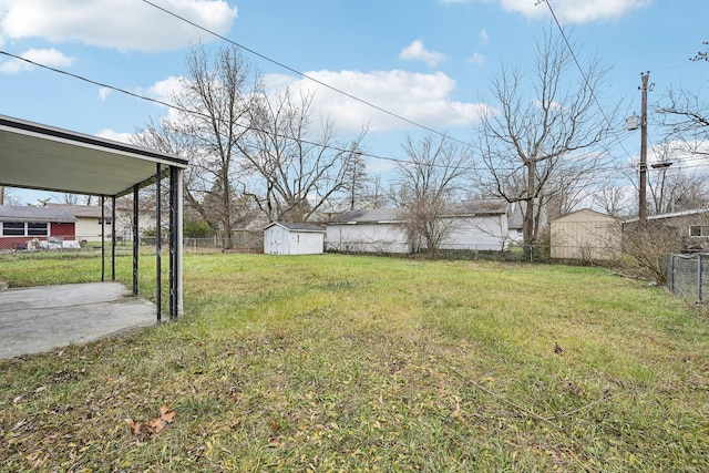 view of yard featuring a patio and a storage shed