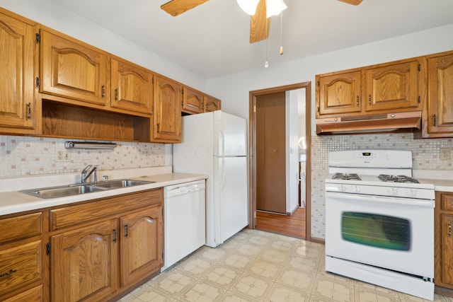 kitchen featuring tasteful backsplash, sink, white appliances, and ceiling fan