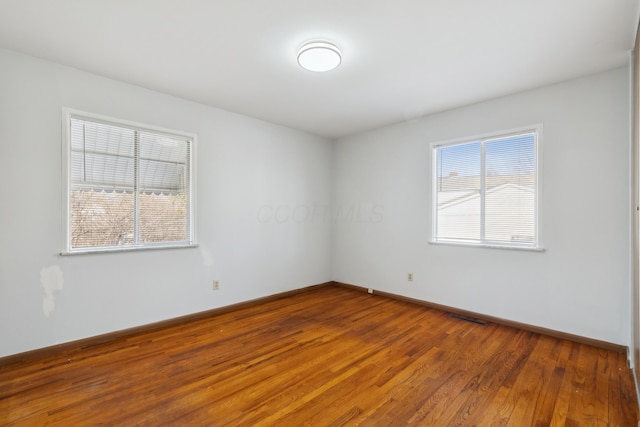 empty room featuring hardwood / wood-style floors