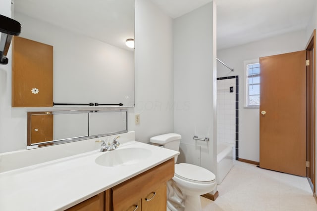 full bathroom with vanity, toilet, and tiled shower / bath combo