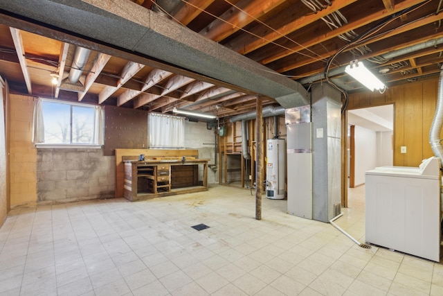 basement with heating unit, washer / clothes dryer, and gas water heater