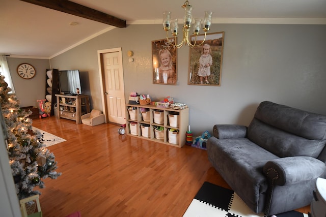 living room with hardwood / wood-style flooring, lofted ceiling with beams, crown molding, and a chandelier