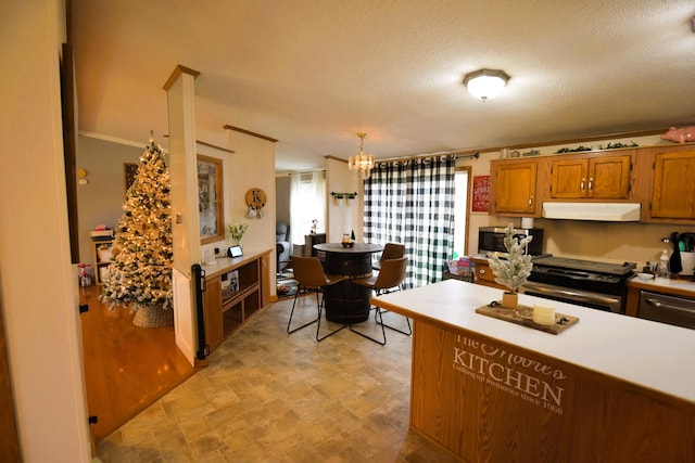 kitchen with range with electric cooktop, a chandelier, pendant lighting, a textured ceiling, and exhaust hood