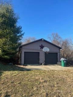 garage featuring a yard