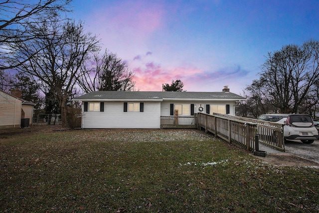 view of front of home with a lawn