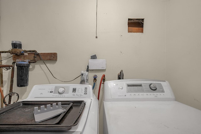 washroom featuring washing machine and dryer