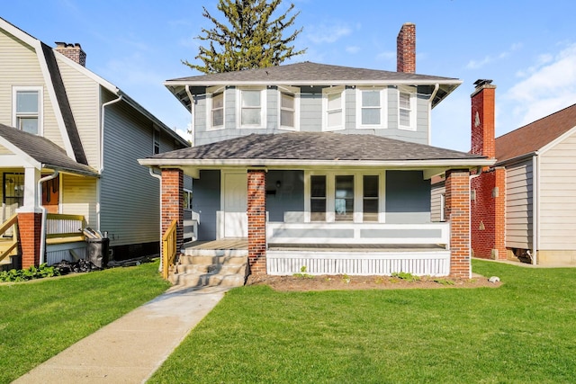 view of front facade featuring a porch and a front yard