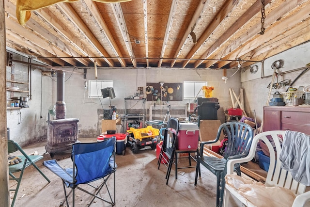 basement featuring a wood stove