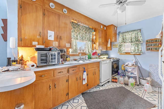 kitchen featuring white appliances, ceiling fan, and sink