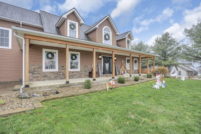 view of front of home featuring covered porch and a front lawn