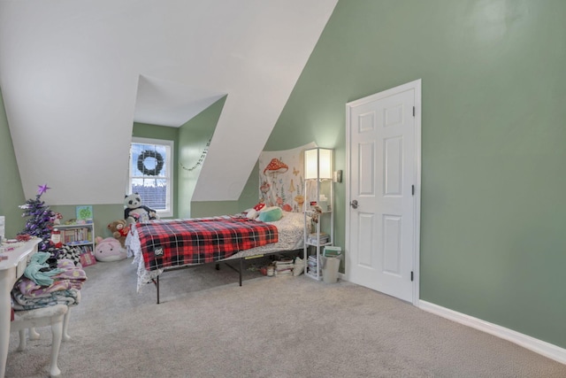 bedroom with carpet flooring and lofted ceiling