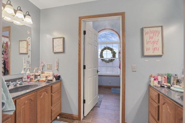 bathroom with hardwood / wood-style floors and vanity