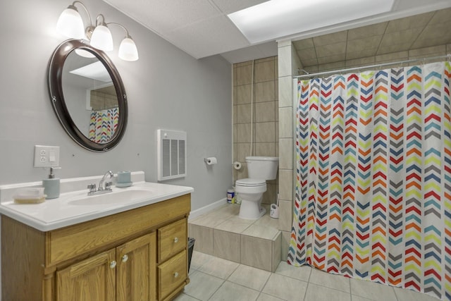 bathroom with toilet, vanity, tile patterned flooring, and a shower with curtain