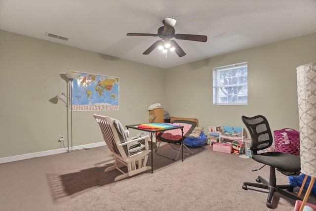 carpeted home office with ceiling fan