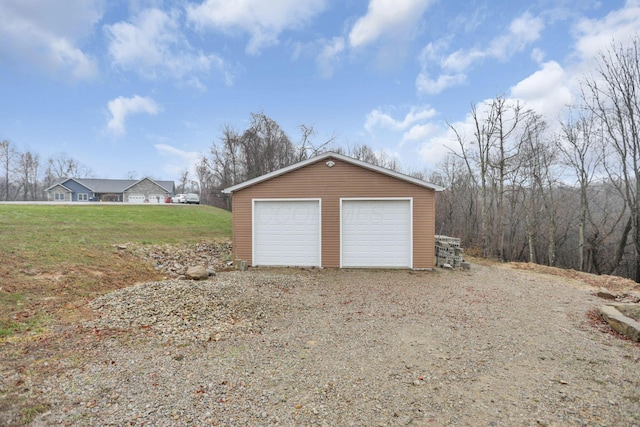 garage with a yard