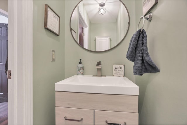 bathroom featuring wood-type flooring and vanity