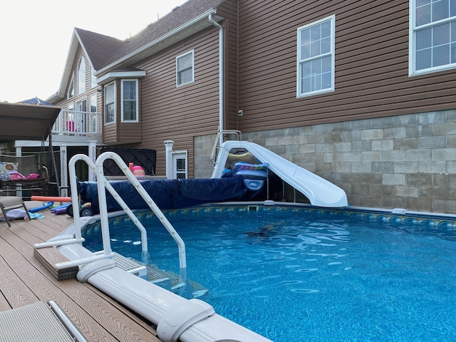 view of pool featuring a water slide