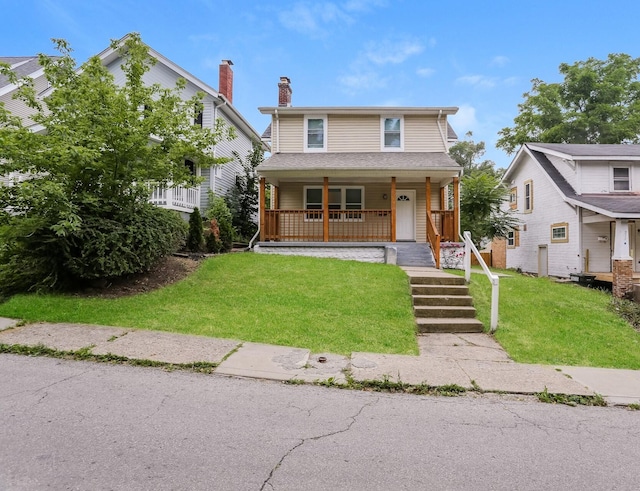 view of front of property with a porch and a front lawn